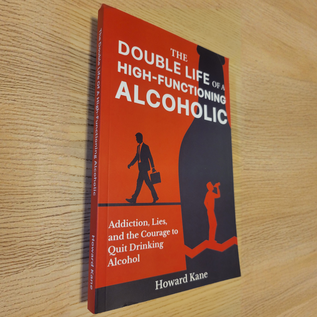 Physical Book titled 'The Double Life of a High-Functioning Alcoholic' by Howard Kane on a wooden surface